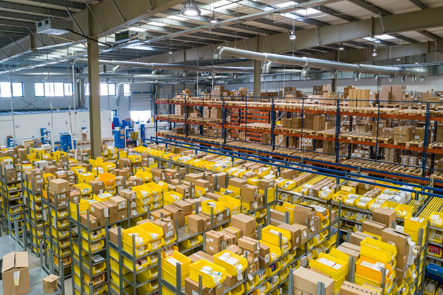 Warehouse aisle with pallet racking and goods ready to ship